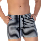 Black and white vertically striped swim trunks with drawstring waistband from gigo polo black beachwear collection