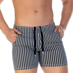 Black and white vertically striped swim trunks with drawstring waistband from gigo polo black beachwear collection