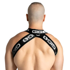 Black gigi brand cross-back harness with white logo branding shown from the back in gigo purity black harness design