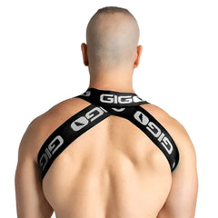 Black gigi brand cross-back harness with white logo branding shown from the back in gigo purity black harness design
