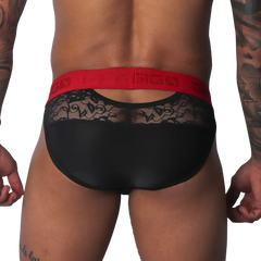 Black brief with sheer floral lace upper panel, solid black lower section, and a bold red branded elastic waistband.