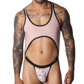 Romantic pink ribbed mesh bodysuit with black trim, a large midriff cutout, and a pink floral lace thong pouch.