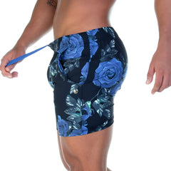 Blue rose patterned athletic shorts with black base and metallic button closure from gigo rose blue beachwear