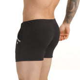 Gigo Scanaling black athletic shorts with subtle textured fabric and sleek silver zipper on side pocket