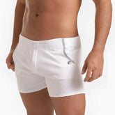 White men’s swim trunks gigo scanaling with subtle ribbed texture and silver zipper detail