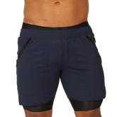 Navy blue gigo sporty blue shorts with black elastic waistband black trim and side zip pockets for athletic use
