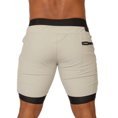 Beige gigo sporty gray short with black elastic waistband and leg cuffs featuring a side zip pocket for activewear