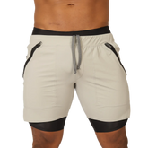 Cream-colored Gigo sporty gray short with black trim, side zippers, and drawstring waistband for athletic use