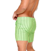 Bright lime green gigo sultan swim trunks with thin black vertical stripes for beachwear use