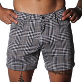Black and white houndstooth print shorts with a subtle gold windowpane check, featuring a classic five-pocket design.