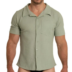 A men’s short-sleeved button-up gigo tissue green shirt in textured light sage green fabric with classic collar
