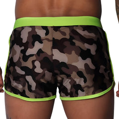 Camouflage print beach shorts with neon yellow waistband and trim, featuring a smooth, athletic fit.