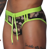 Camouflage swim brief with neon yellow trim, cut-out sides, and a drawstring front with metallic tips.