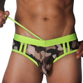 Neon yellow and camouflage print swim brief with a wide elastic waistband, drawstring, and side-paneled cutout design.