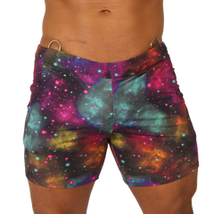 Vibrant Gigo Universe beachwear galaxy-print swim trunks with swirling nebulae in purple teal pink and orange