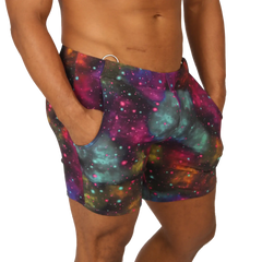 Gigo universe beachwear vibrant galaxy-print swim trunks with magenta teal and purple nebulae and star-like dots