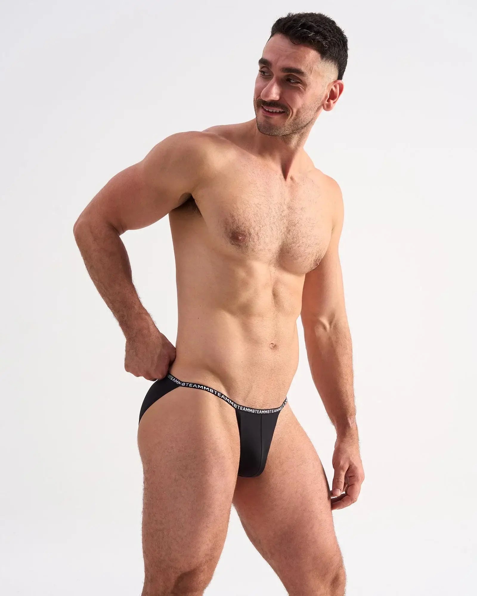 Black glide micro brief with white elastic waistband featuring repeating text in comfortable microfiber material