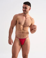 Red glide micro brief athletic briefs with thin elastic waistband featuring repeating white text