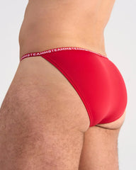 Red glide micro brief underwear featuring a red color and white teammb logo waistband for comfortable daily wear