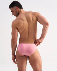 A sleek solid pink glide micro brief with smooth fabric finish designed for comfortable everyday wear