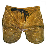 Glitter booty short featuring gold glitter fabric with a black drawstring waistband for a stylish look