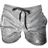 Shiny silver star patterned glitter booty short with black drawstring waistband made from glittery fabric