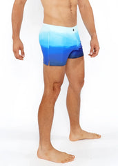 Blue gradient printed swim shorts featuring a smooth seamless design ideal for beach and pool wear