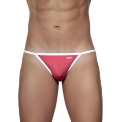 A vibrant pink groovin accent string bikini rouge red thong with white trim and a small brand tag front view
