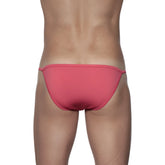 A sleek coral-pink groovin string bikini rouge red swim trunks with smooth fabric and thin side ties