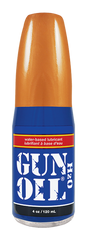 Orange and blue gun oil h2o water-based lubricant in a clear glass bottle for smooth and safe use