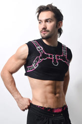 Harness crop top with black mesh body and pink silver leather straps featuring metal buckles and d rings
