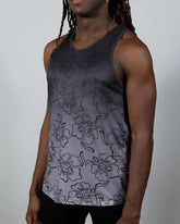 A dark gray hibiscus ombre print tank top with black outlined flowers and subtle fading to lighter gray at the bottom