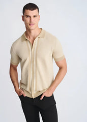 Beige short-sleeved honeycomb textured knit polo shirt with matching collar and button front design