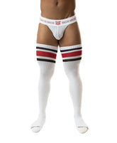 White mesh briefs paired with nasty pig hookd up thigh high red and black striped knee-high socks in front view