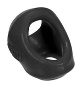 Hünkyjunk Clutch black silicone cock and ball sling with dual contoured openings against a white background.
