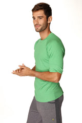 A vibrant bamboo green short-sleeved hybrid crew neck raglan tee made of soft cotton fabric