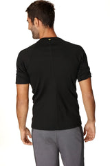 Black hybrid crew neck raglan tee back view with short sleeves, subtle vertical seam, and small green neckline logo