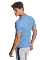 Light blue hybrid v-neck short-sleeved athletic shirt with ribbed texture and subtle back seam detail shown from back