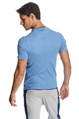 Light blue short-sleeved hybrid v-neck athletic shirt with ribbed texture and central back zipper shown from the back