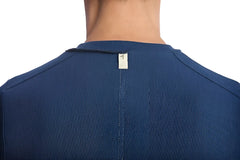 Blue ribbed knit hybrid v-neck shirt in royal with a small white tag at the neckline