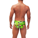 Vibrant lime green icker sea bricks bikini swimwear trunks with bold geometric pink purple and teal accents