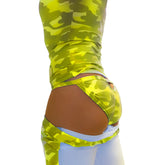 Back view of a vibrant lime green and dark olive camouflage high waisted athletic outfit with a cutout design