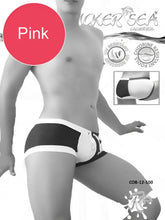 Black and white swim trunks with pink accent label from icker sea chess duotone square cut trunk swimwear collection