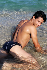 Black icker sea bikini swim trunks with white contrast stitching and subtle waistband logo for swimwear use