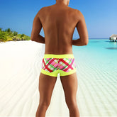 Icker Sea contrast trim plaid square cut swim trunks in bright neon yellow with bold pink red and white pattern