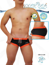 Icker Sea contrast trim square cut black and orange swim trunks with white drawstrings and logo on left leg