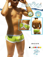 Bright lime green icker sea curved hemline u shorts swim trunks with white trim and drawstring for swimwear use