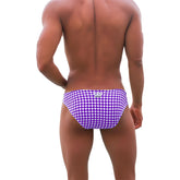 Icker Sea dotted bikini swimwear purple swim trunks with white polka dots and silver logo at the waistband