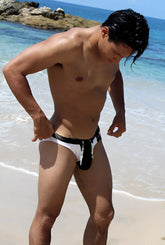 Black and white Icker Sea Duotone bikini swimwear trunks with a distinctive front pouch design for swimming