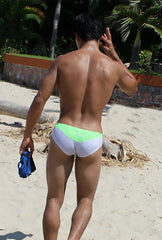 The back of icker sea duotone bikini swimwear green cob 15 22 swim trunks with lime green waistband and fabric logo